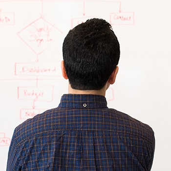 man engaged in stock market predictive analytics