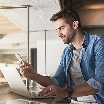 man on his phone checking nonprofits' data