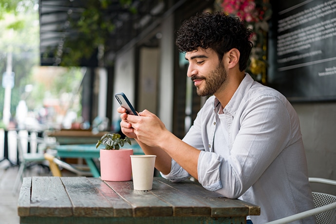 woman smiling while working on customers' database